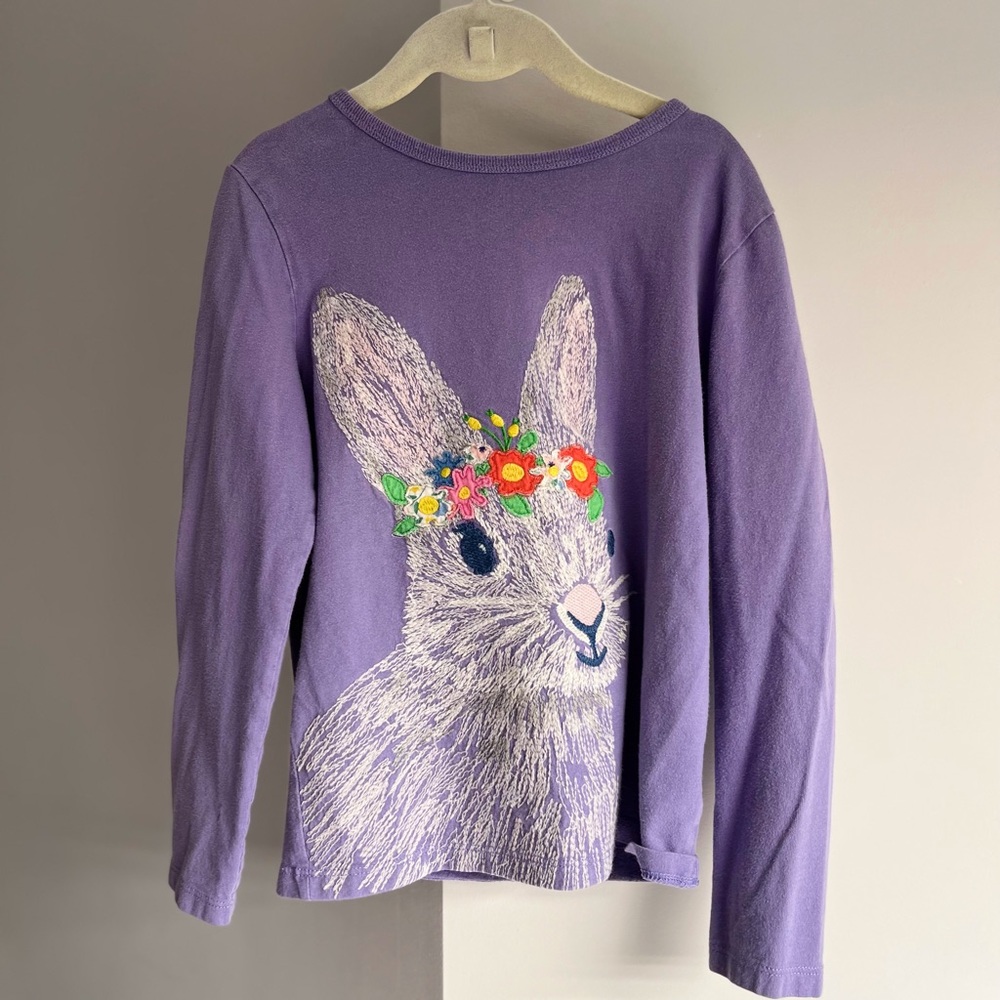 Mini boden girls purple long sleeve shirt with bunny print on front.